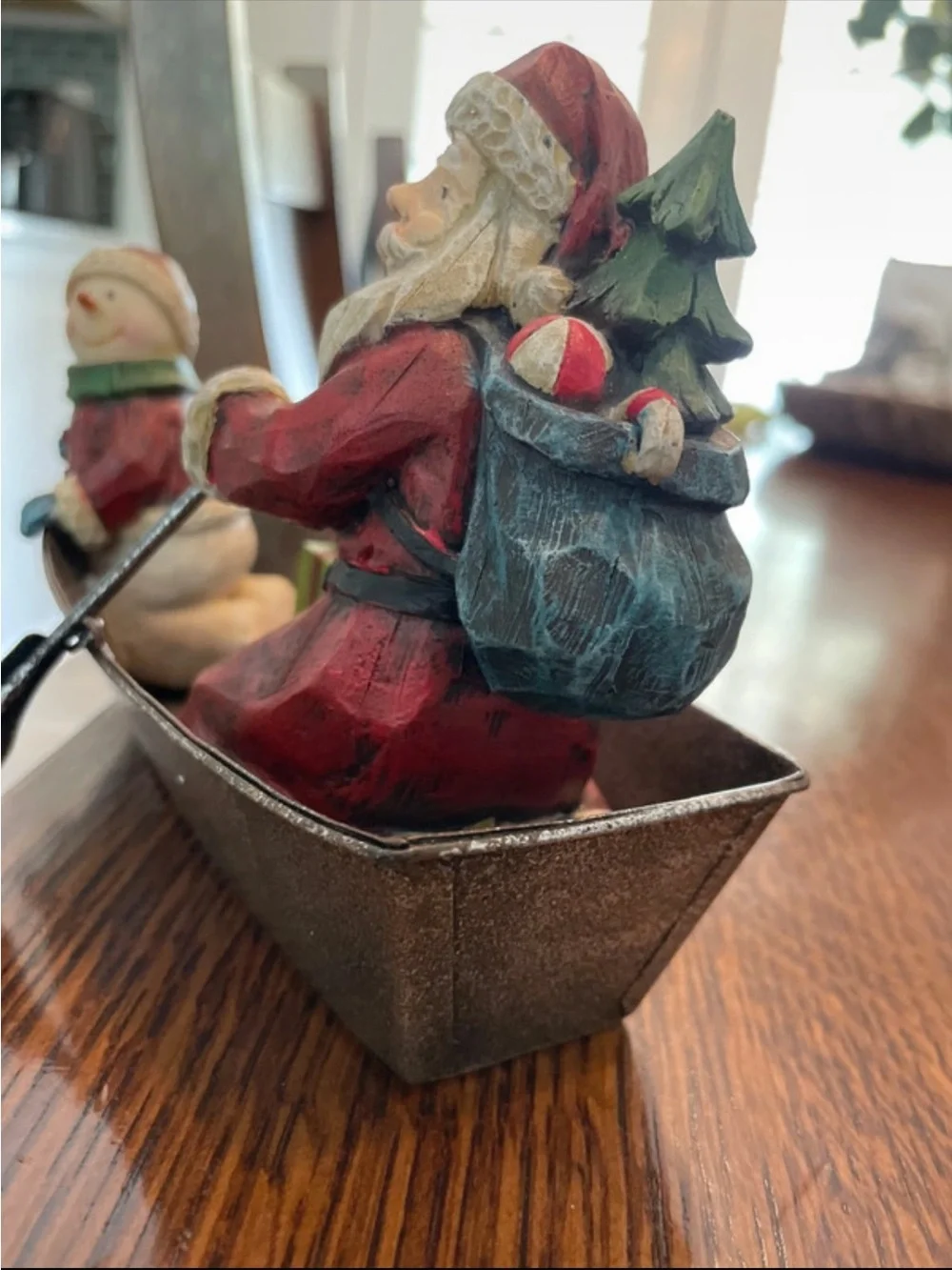 Santa and Snowman in metal fishing boat